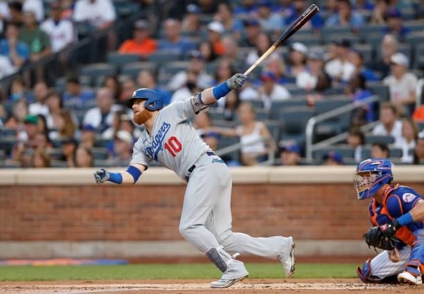 Justin Turner of the Los Angeles Dodgers follows through on his first inning two run home run against the New York Mets at Citi Field on August 15,...