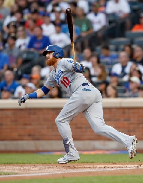 Justin Turner of the Los Angeles Dodgers follows through on his first inning two run home run against the New York Mets at Citi Field on August 15,...