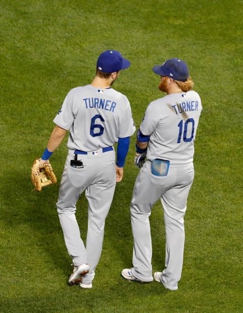 Trea Turner and Justin Turner of the Los Angeles Dodgers talk after an inning against the New York Mets at Citi Field on August 15, 2021 in New York...