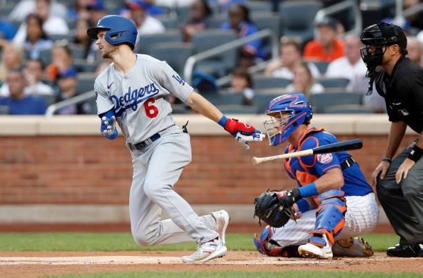 Trea Turner of the Los Angeles Dodgers singles during the first inning against the New York Mets at Citi Field on August 15, 2021 in New York City....