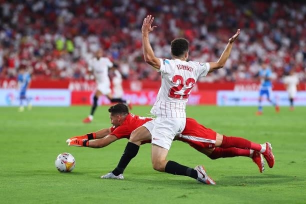 Oussama Idrissi of Sevilla FC competes for the ball with Stole Dimitrievski of Rayo Vallecano during the La Liga Santader match between Sevilla FC...
