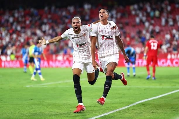 Youssef En-Nesyri and Erik Lamela of Sevilla FC celebrate scoring his teams third goal during the La Liga Santader match between Sevilla FC and Rayo...