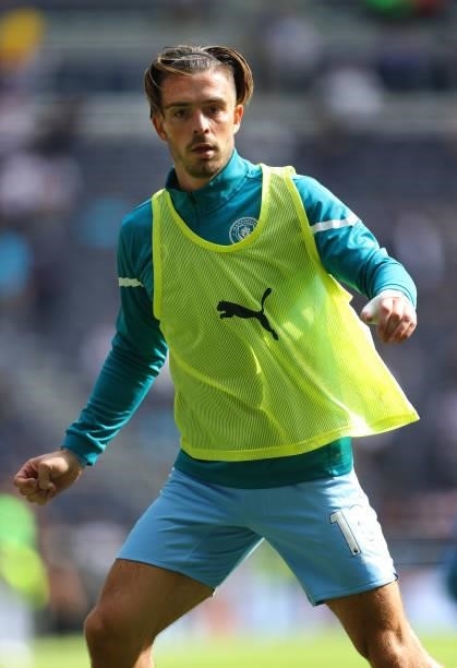 Jack Grealish of Manchester City looks on during the warm up prior to the Premier League match between Tottenham Hotspur and Manchester City at...