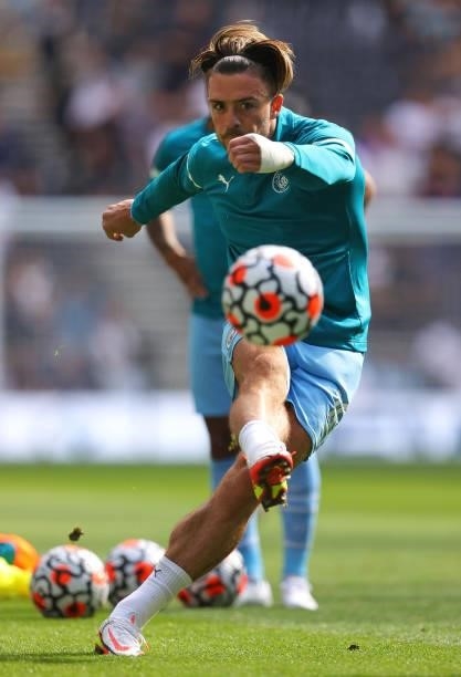 Jack Grealish of Manchester City shoots during the warm up prior to the Premier League match between Tottenham Hotspur and Manchester City at...