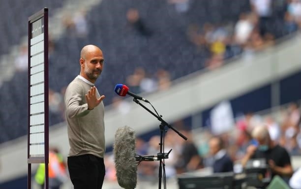 Pep Guardiola the manager of Manchester City looks on prior to the Premier League match between Tottenham Hotspur and Manchester City at Tottenham...