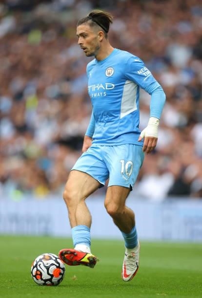 Jack Grealish of Manchester City runs with the ball during the Premier League match between Tottenham Hotspur and Manchester City at Tottenham...