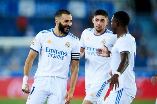 Karim Benzema of Real Madrid celebrates with teammates after scoring their team's first goal during the LaLiga Santader match between Deportivo...
