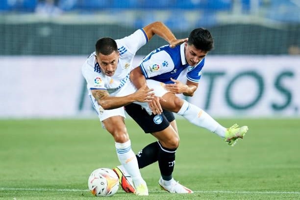 Eden Hazard of Real Madrid duels for the ball with Manu Garcia of Deportivo Alaves during the LaLiga Santader match between Deportivo Alaves and Real...