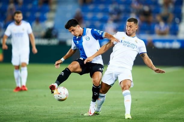 Eden Hazard of Real Madrid duels for the ball with Manu Garcia of Deportivo Alaves during the LaLiga Santader match between Deportivo Alaves and Real...