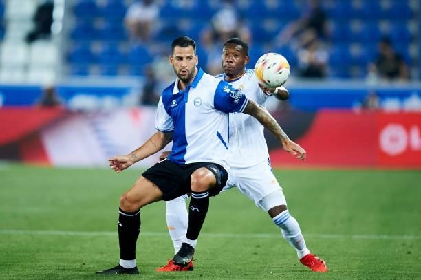 David Alaba of Real Madrid duels for the ball with Edgar Mendez of Deportivo Alaves during the LaLiga Santader match between Deportivo Alaves and...