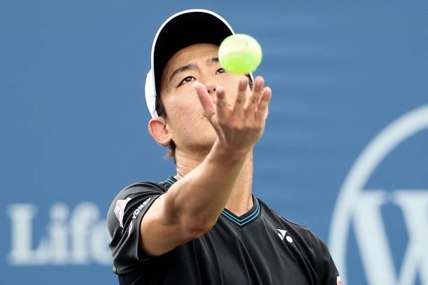 Yoshihito Nishioka of Japan serves during his match against Lloyd Harris of South Africa during the Western & Southern Open - Day 2 at Lindner Family...