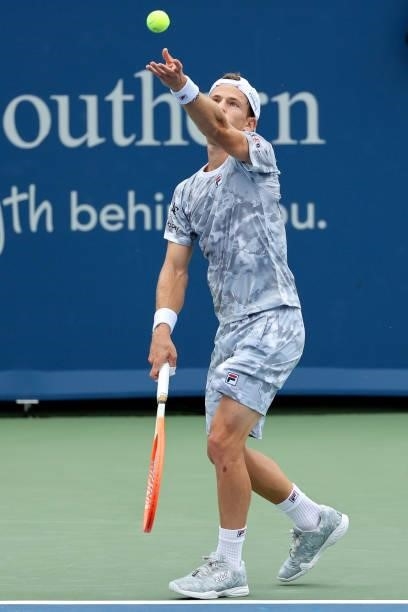 Diego Schwartzman of Argentina serves during his match against Daniel Evans of Great Britain during the Western & Southern Open - Day 2 at Lindner...