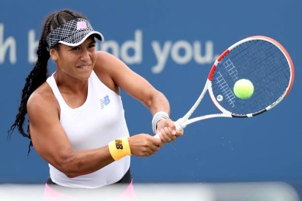 Heather Watson of Great Britain returns a shot to Aliaksandra Sasnovich of Belarus during the Western & Southern Open at Lindner Family Tennis Center...