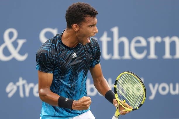 Felix Auger-Aliassime of Canada celebrates match point against Marlon Fucsovics of Hungary during the Western & Southern Open at Lindner Family...