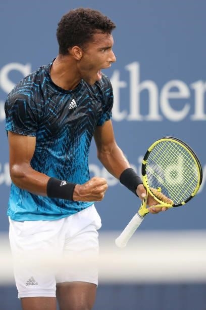 Felix Auger-Aliassime of Canada celebrates match point against Marlon Fucsovics of Hungary during the Western & Southern Open at Lindner Family...
