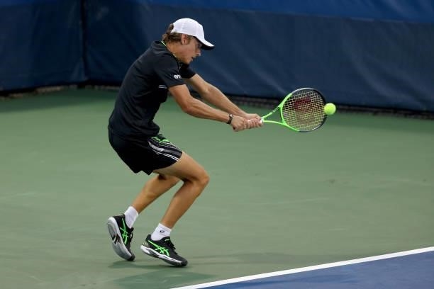 Alex de Minaur of Australia plays a backhand during his match against Filip Krajinovic of Serbia during the Western & Southern Open - Day 2 at...