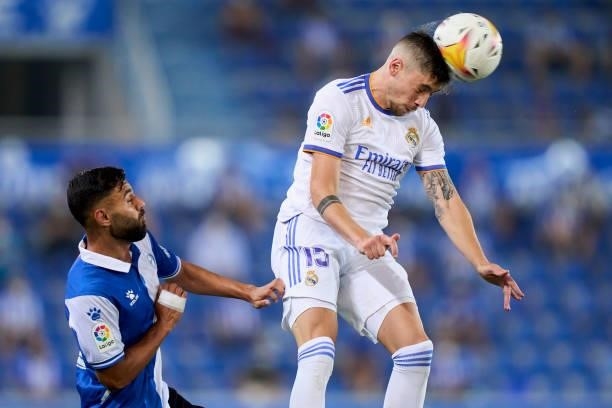 Ruben Duarte of Deportivo Alaves battle for the ball with Federico Valverde of Real Madrid CF during the La Liga Santader match between Deportivo...