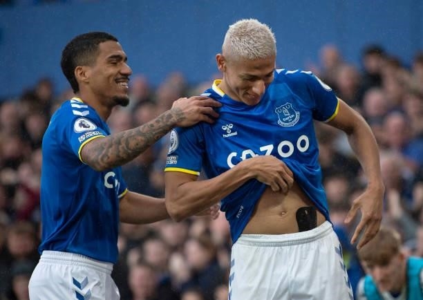 Richarlison of Everton celebrates scoring the second goal with team mate Allan during the Premier League match between Everton and Southampton at...