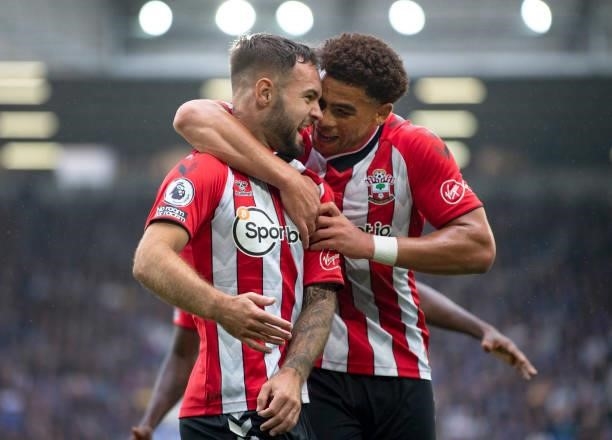 Adam Armstrong of Southampton celebrates with team mate Che Adams after scoring during the Premier League match between Everton and Southampton at...