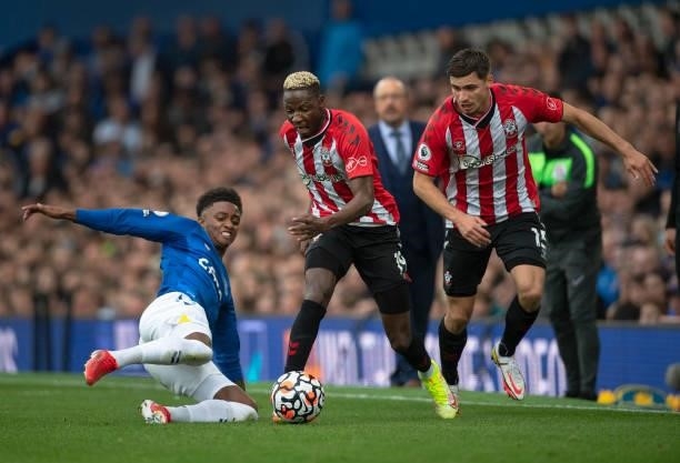 Moussa Djenepo and Romain Perraud of Southampton in action with Demarai Gray of Everton during the Premier League match between Everton and...