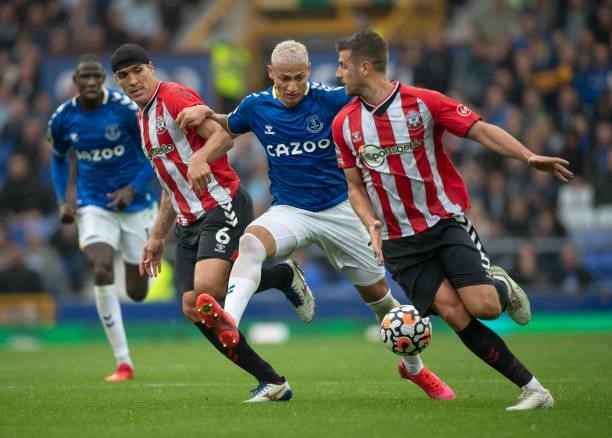 Richarlison of Everton in action with Oriol Romeu and Jack Stephens of Southampton during the Premier League match between Everton and Southampton at...