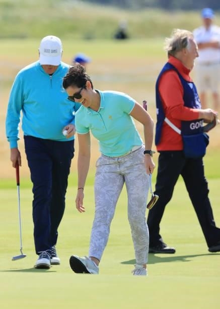Presenter, Eilidh Barbour and Martin Slumbers, Chief Executive of the R&A react on the eighteenth green during the Pro-AM prior to the AIG Women's...