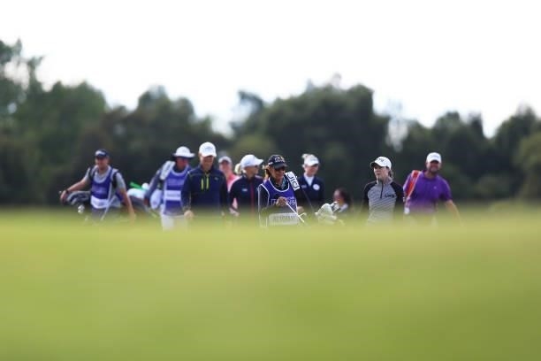 Brittany Altomare of The United States and her caddie walk along the course during a practice round prior to the AIG Women's Open at Carnoustie Golf...