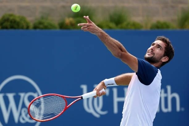 Marin Cilic of Croatia serves during his match against Aslan Karatsev of Russia during Western & Southern Open - Day 3 at Lindner Family Tennis...