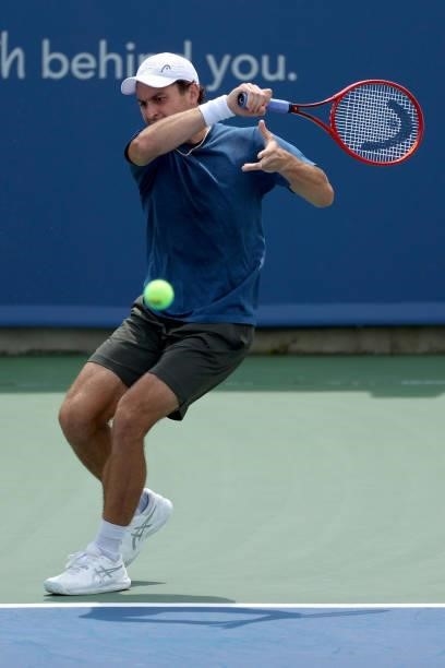 Aslan Karatsev of Russia plays a forehand during his match against Marin Cilic of Croatia during Western & Southern Open - Day 3 at Lindner Family...