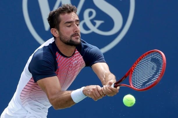 Marin Cilic of Croatia plays a backhand during his match against aj during Western & Southern Open - Day 3 at Lindner Family Tennis Center on August...