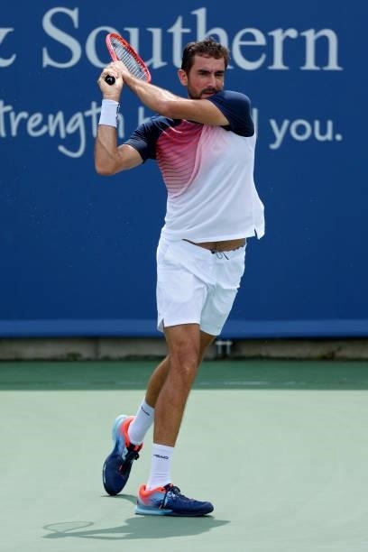 Marin Cilic of Croatia plays a backhand during his match against Aslan Karatsev of Russia during Western & Southern Open - Day 3 at Lindner Family...
