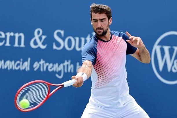 Marin Cilic of Croatia plays a forehand during his match against Aslan Karatsev of Russia during Western & Southern Open - Day 3 at Lindner Family...