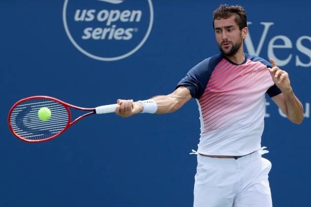 Marin Cilic of Croatia plays a forehand during his match against Aslan Karatsev of Russia during Western & Southern Open - Day 3 at Lindner Family...