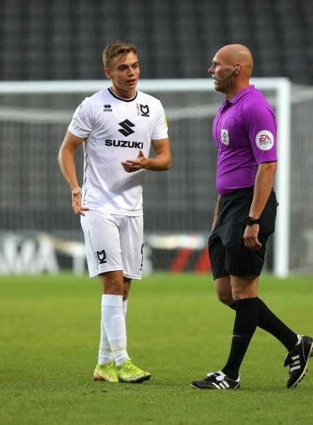 Referee Charles Breakspear makes a point to Scott Twine of Milton Keynes Dons during the Sky Bet League One match between Milton Keynes Dons and...