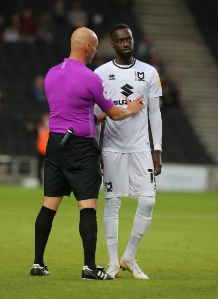 Referee Charles Breakspear makes a point to Mo Eisa of Milton Keynes Dons during the Sky Bet League One match between Milton Keynes Dons and Charlton...