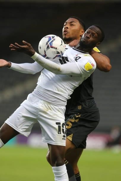 Mo Eisa of Milton Keynes Dons attempts to control the ball under pressure from Akin Famewo of Charlton Athletic during the Sky Bet League One match...