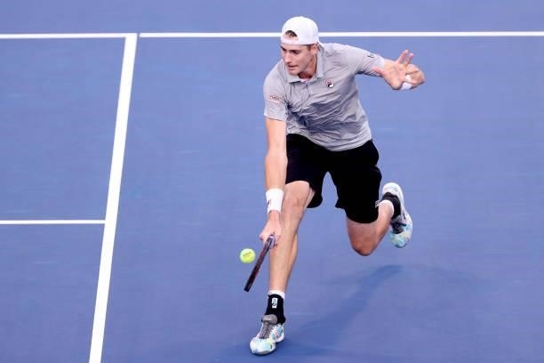 John Isner returns a shot to Cameron Norrie of Great Britain during the Western & Southern Open at Lindner Family Tennis Center on August 17, 2021 in...