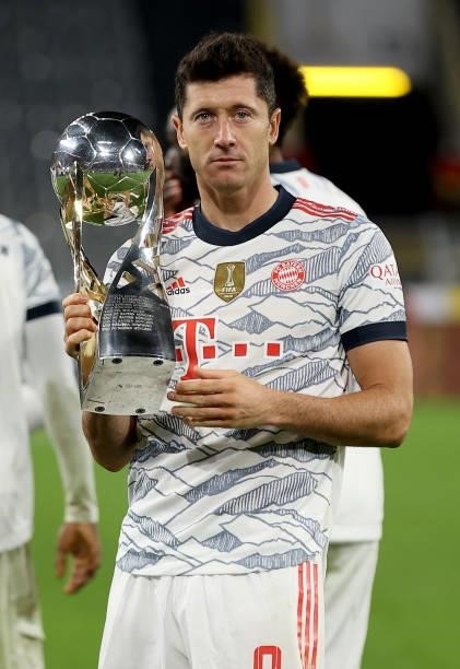 Robert Lewandowski of Muenchen lifts the trophy after winning the Supercup 2021 match between FC Bayern München and Borussia Dortmund at Signal Iduna...