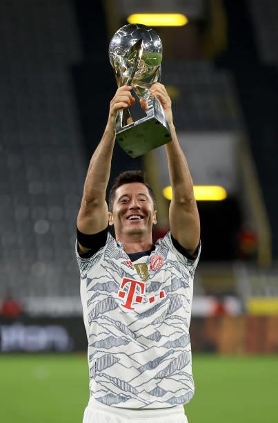 Robert Lewandowski of Muenchen lifts the trophy after winning the Supercup 2021 match between FC Bayern München and Borussia Dortmund at Signal Iduna...