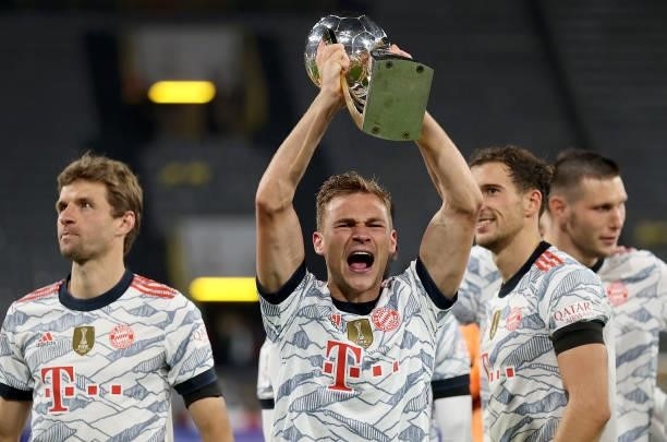 Joshua Kimmich of Muenchen lifts the trophy after winning the Supercup 2021 match between FC Bayern München and Borussia Dortmund at Signal Iduna...