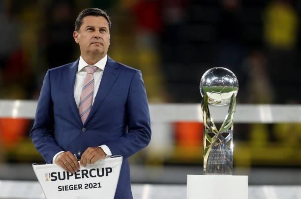 Christian Seifert, Managing Director DFL GmbH is seen with the Supercup trophy after the Supercup 2021 match between FC Bayern München and Borussia...