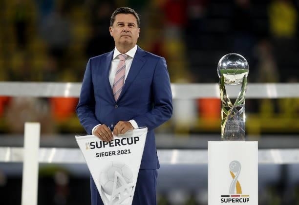 Christian Seifert, Managing Director DFL GmbH is seen with the Supercup trophy after the Supercup 2021 match between FC Bayern München and Borussia...