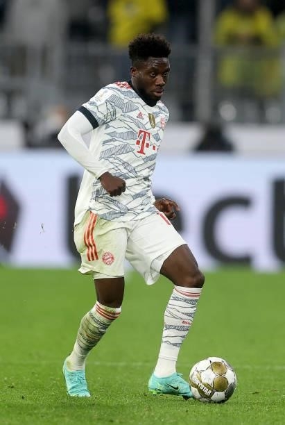 Alphonso Davies of Muenchen runs with the ball during the Supercup 2021 match between FC Bayern München and Borussia Dortmund at Signal Iduna Park on...