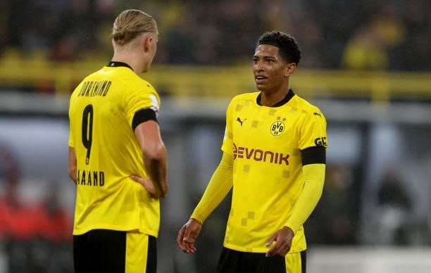 Jude Bellingham of Dortmund speaks to Erling Haaland during the Supercup 2021 match between FC Bayern München and Borussia Dortmund at Signal Iduna...