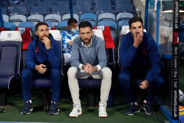Carlos Coberán the Head Coach of Huddersfield Town between his assistant coaches Narcís Pelach and Jorge Alacón during the Sky Bet Championship match...