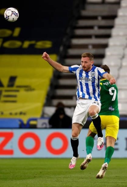 Tom Lees on debut for Huddersfield Town out jumps Ched Evans of Preston North End during the Sky Bet Championship match between Huddersfield Town and...