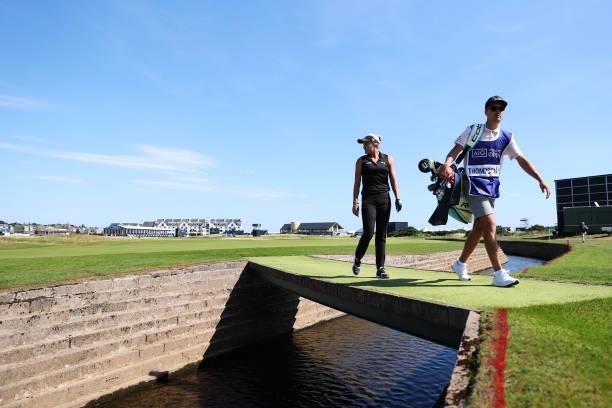 Lexi Thompson of The United States and her caddie walk over a bridge on the seventeenth hole during the Pro-Am prior to the AIG Women's Open at...