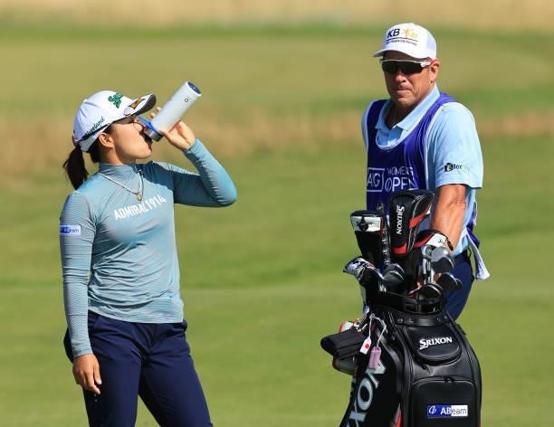 Nasa Hataoka of Japan takes a drink from an official AIG Women's Open bottle during the Pro-Am prior to the AIG Women's Open at Carnoustie Golf Links...