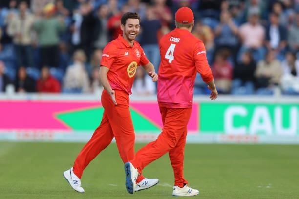 Ryan Higgins and Josh Cobb of Welsh Fire celebrate a wicket during The Hundred match between Welsh Fire Men and London Spirit Men at Sophia Gardens...