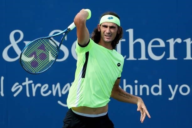 Lloyd Harris of South Africa plays a forehand during his match against Alexander Zverev of Germany during Western & Southern Open - Day 4 at Lindner...